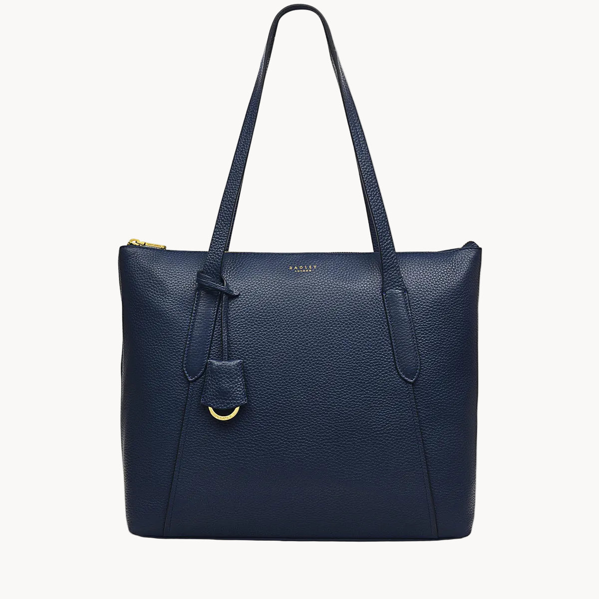 Navy blue leather handbag with a gold clasp on a white background