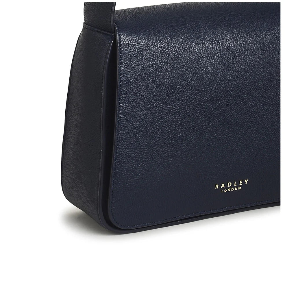 Radley Westwell Lane Medium Flapover Crossbody Bag in Ink - detail of leather-covered magnetic fastening